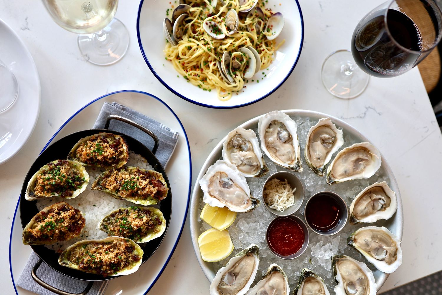 Fresh raw oysters, spaghetti and clams, and chargrilled oysters paired with wine.
