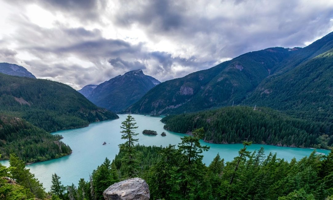 View from a rocky ledge on a beautiful azure lake in the mountains in Diablo Lake, Washington State,
