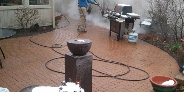 Paver Patio being steam cleaned by Mr. Clean Pressure Washing. 