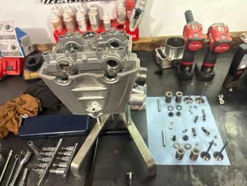 Motorcycle Cylinder head undergoing valve service at ADK Services LTD.