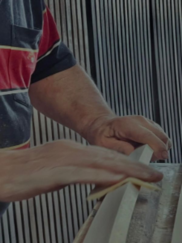 Worker crafting wood panels