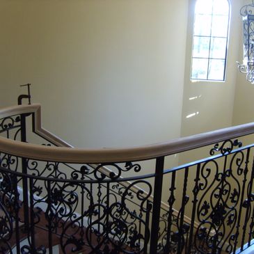Modern wooden staircase with sleek metal railings in a residential home 