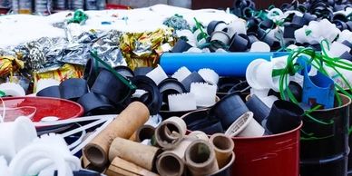 A large assortment of various plastic and cardboard waste items.