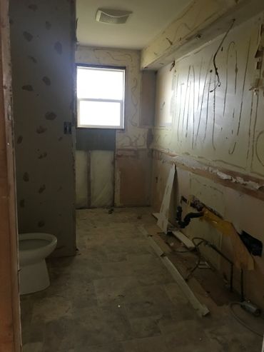 A bathroom remodel, ready for patchwork and to be put back togethor.