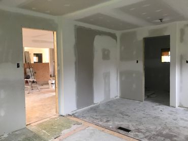 A bedroom fully drywalled ready for primer.
