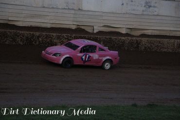 Pink race car number 41 on a dirt track.
