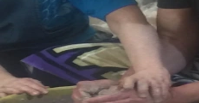 Two people holding hands, showing a close bond.