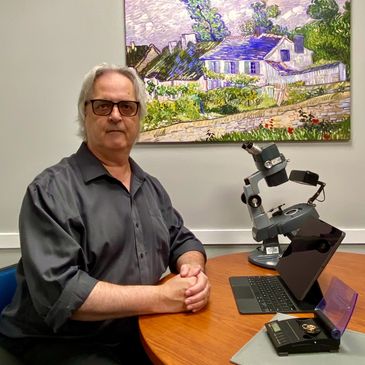 Gemologist sitting at Desk