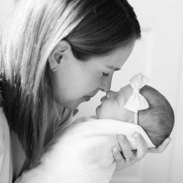 Mommy admiring her precious bundle.