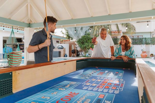 Group of people playing craps at a private home in Palm Beach Aruba