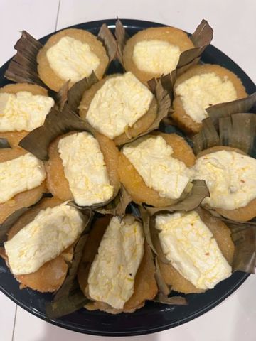 Traditional steamed cakes with a creamy topping.