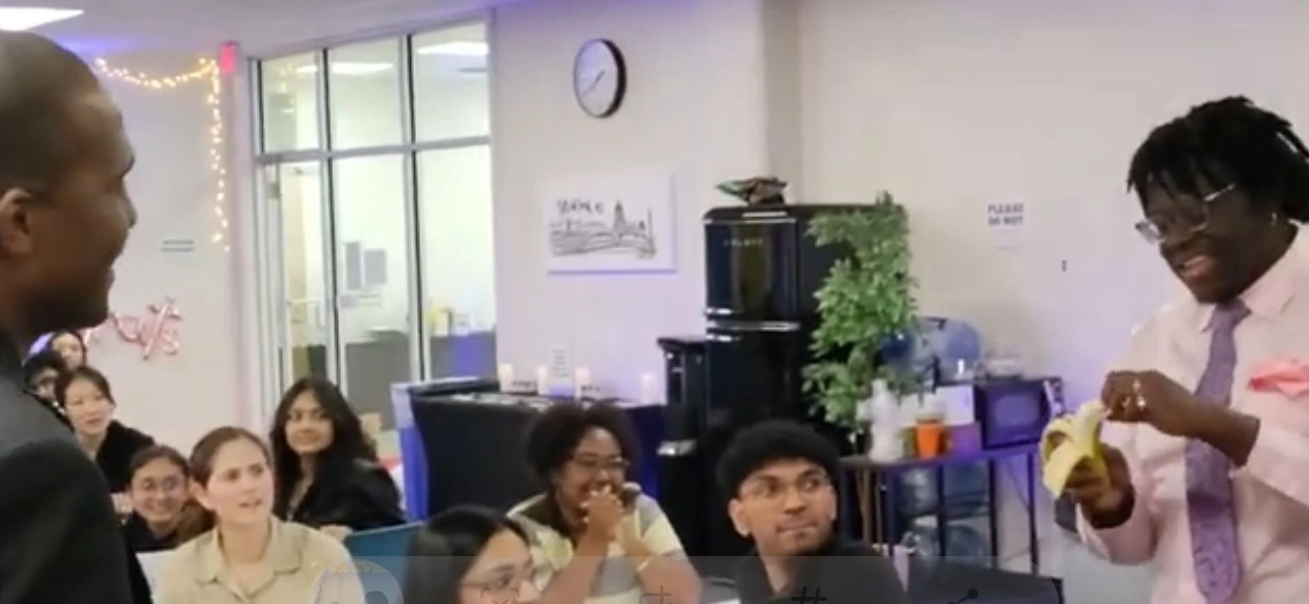 Magician having fun with college students 