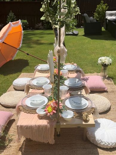 Blush colored luxury picnic theme with large umbrellas