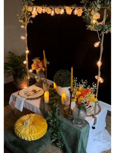 Table setting for two with lights and candles 