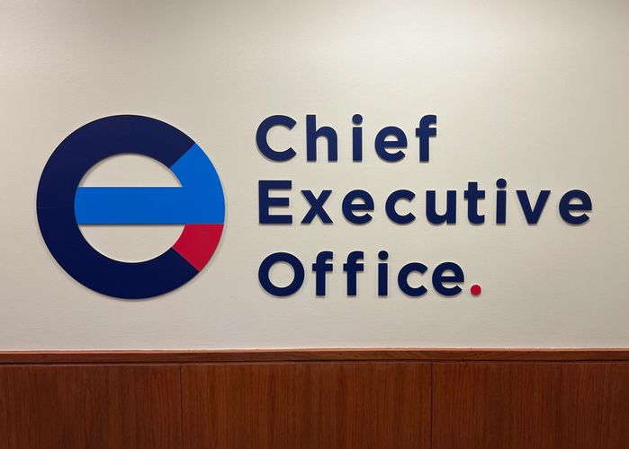 Dimensional acrylic signage for modern institutional office with durable professional presentation.