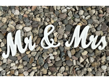 Mr. and Mrs. sign