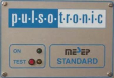Close-up of a Pulsotronic device panel with indicator lights and a standard label.