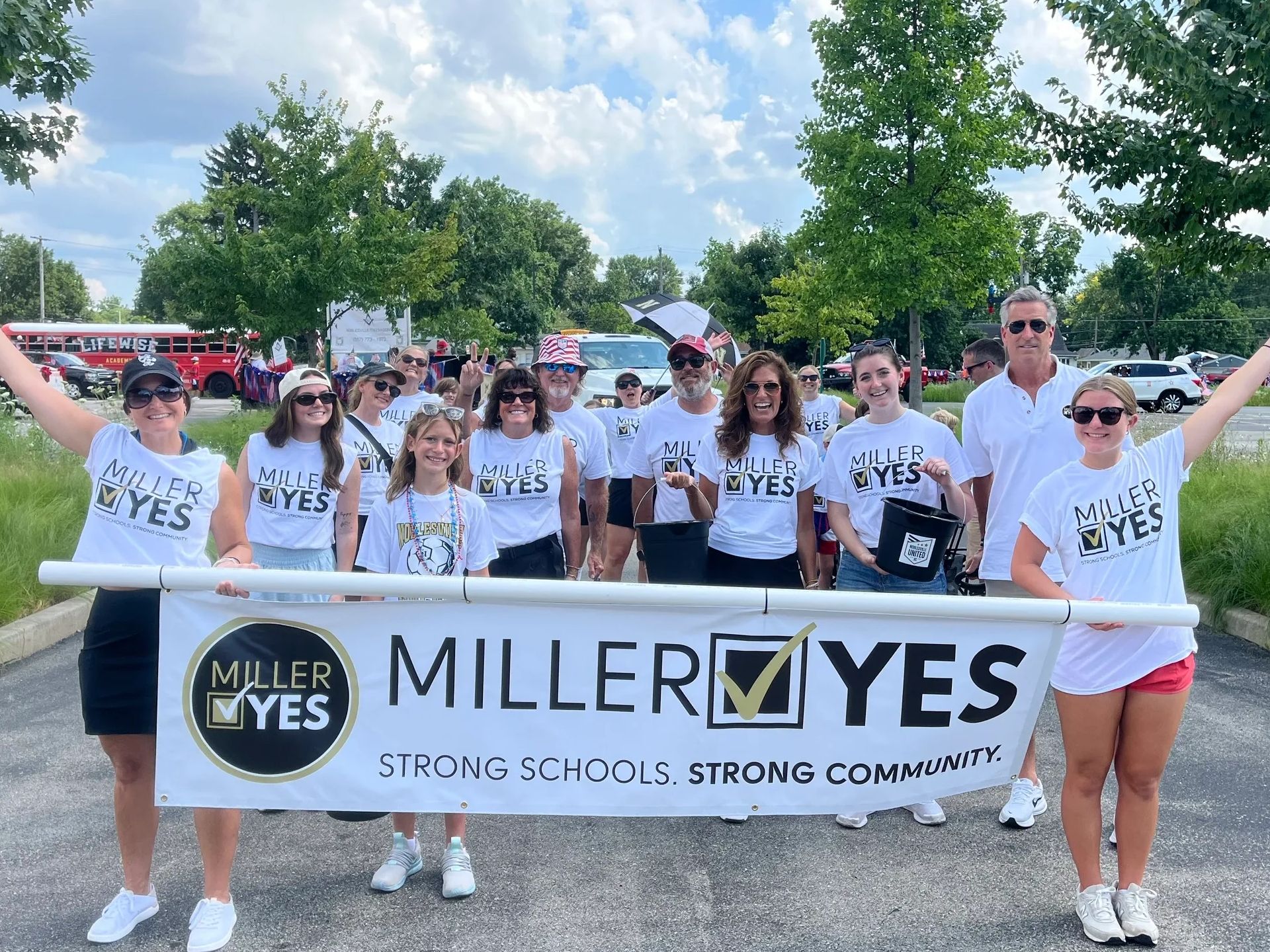 Group of supporters waving at parade