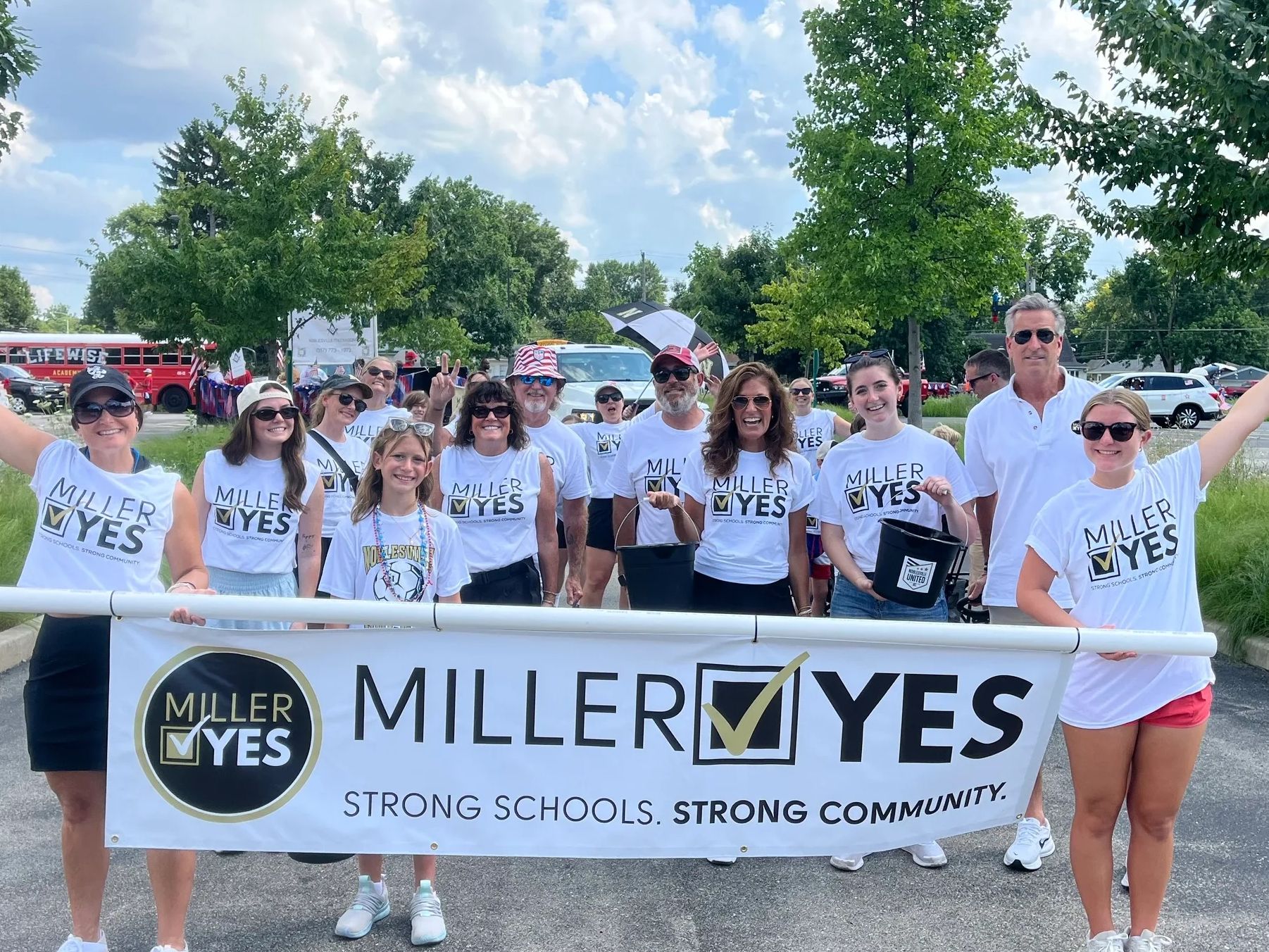 Group of supporters waving at parade