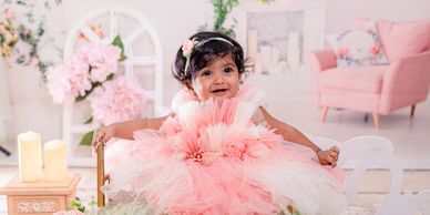 A New Born Baby Posing for a beautiful home Photoshoot