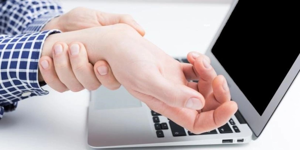 A man holding his hand joint called as Arthritis.