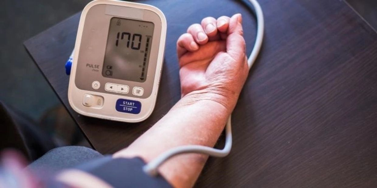 A man estimating his blood pressure level.