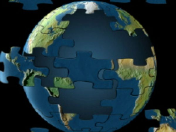 A globe depicted as a jigsaw puzzle with missing pieces.
