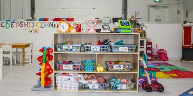 Classroom toy and learning supplies organized on shelves.