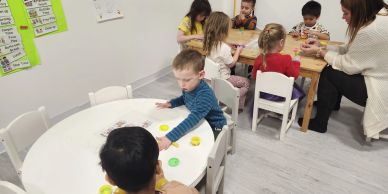 Children playing and learning in a classroom setting.