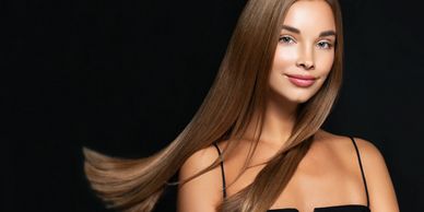 Model showcasing ultra-sleek, shiny, straight long hair achieved with a keratin treatment.
