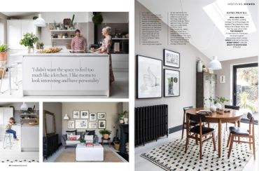 Modern kitchen and dining area with stylish decor and natural light.