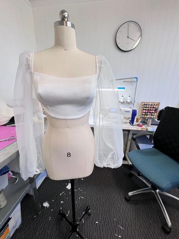 A wedding dress top requiring re-modelling to suit a pregnant bride to be. 