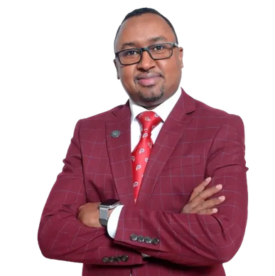 Man in red suit with glasses crossing arms.