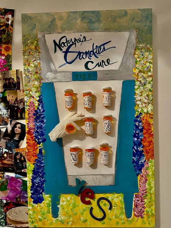Artistic display of prescription bottles labeled as natural cancer cure.
