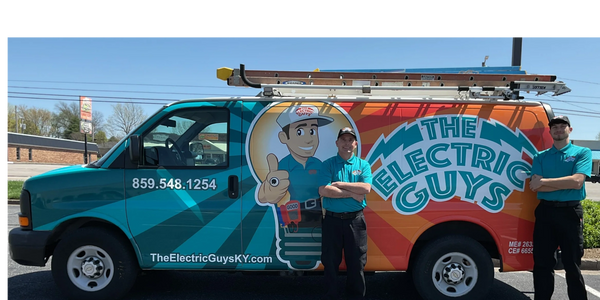 Techs Brandon and Carl, in front of the van. Ready to assist you with a smile!