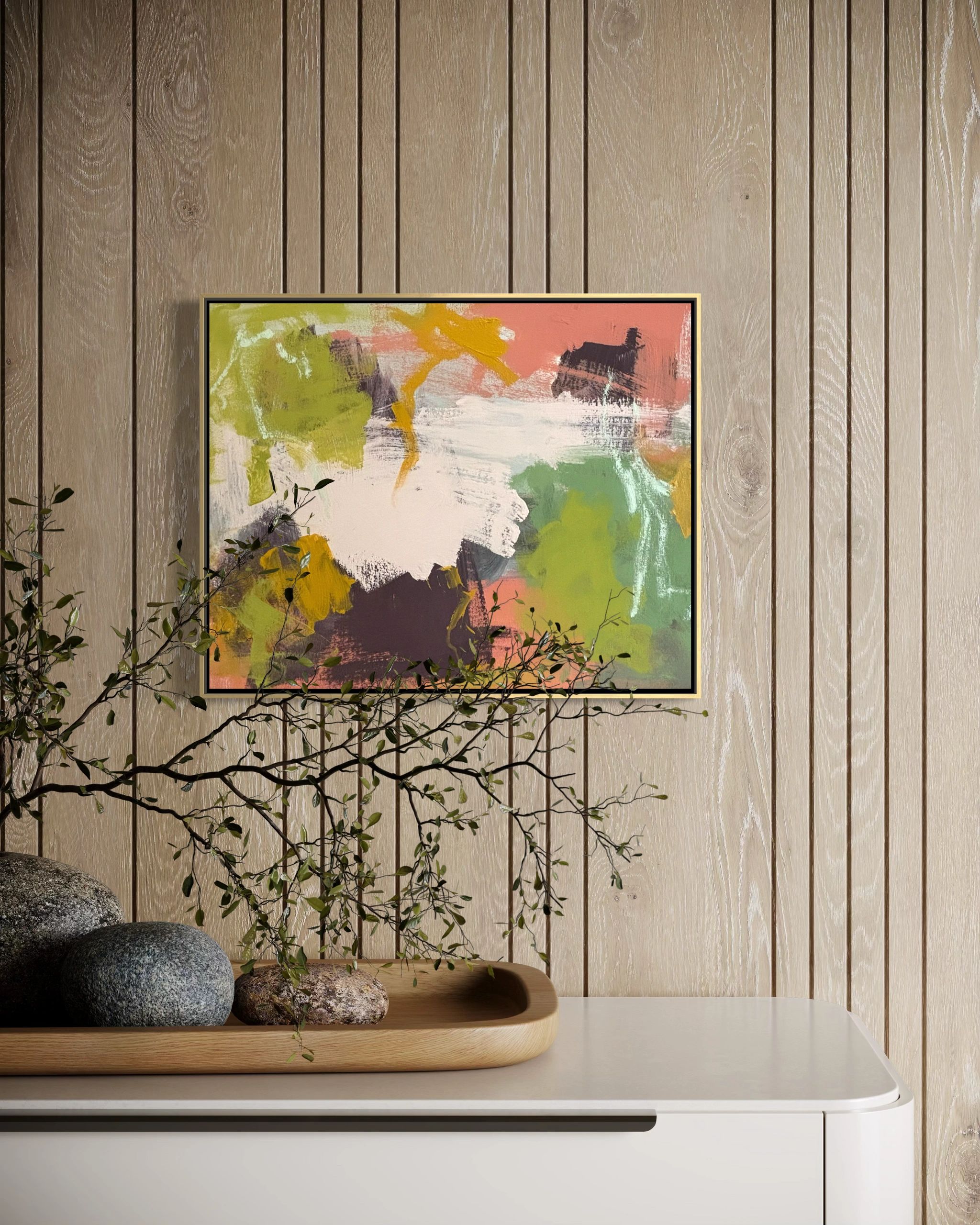 Abstract painting with green, white, and orange tones on a wooden wall above a white dresser.