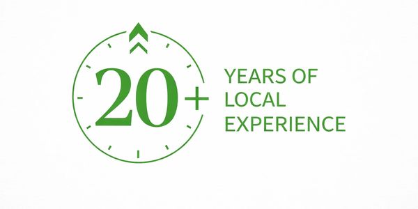 Green logo highlighting 20+ years of local experience.