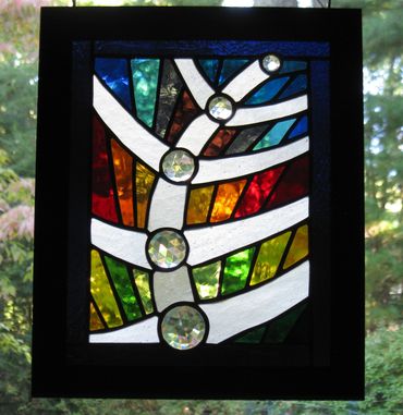 stained glass with clear faceted jewels, copper foil technique, abstract rising