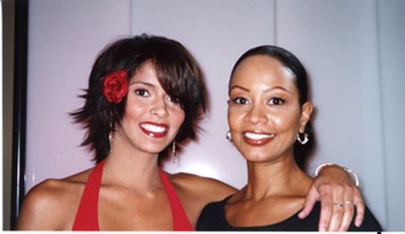 two women looking forward and smiling