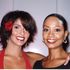 two women looking forward and smiling