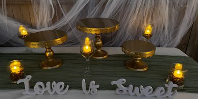 Gold Round Cake Stand & Love is Sweet Sign Combo with Special Lighting for a warm and romantic vibe.
