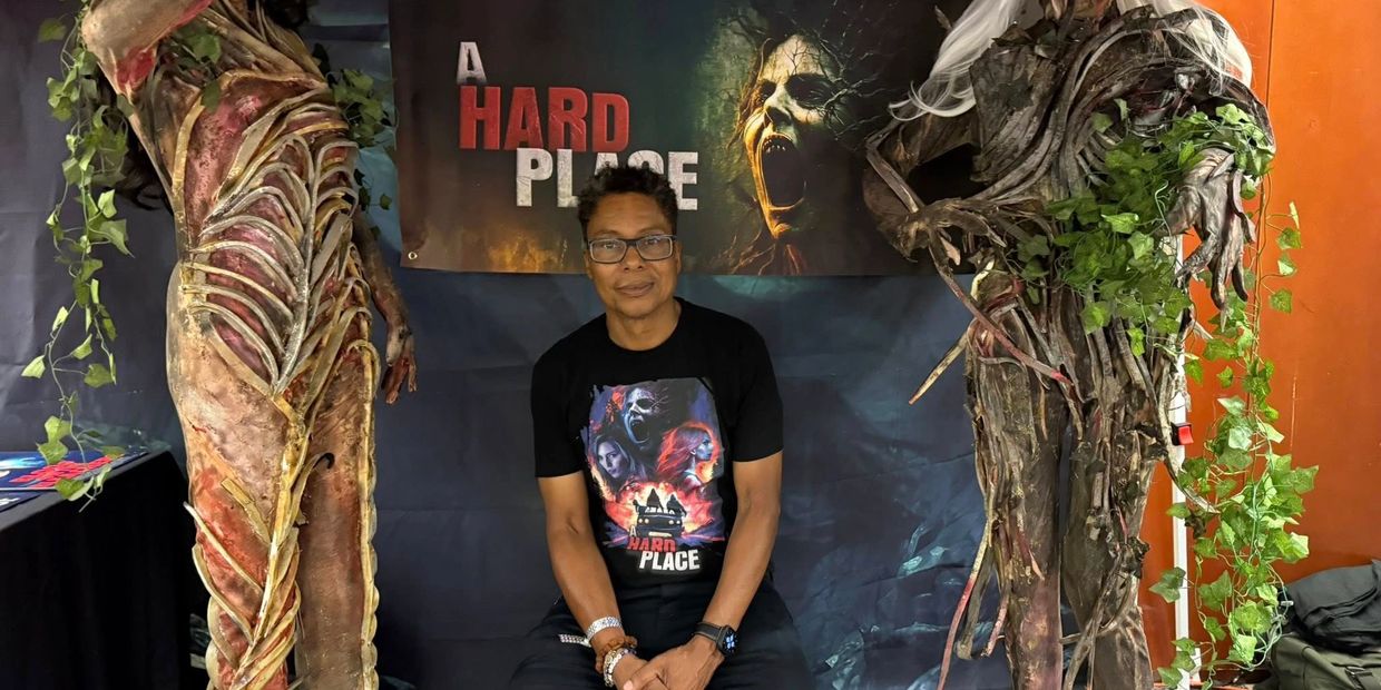 Sean Reid with creature props promoting the horror movie A Hard Place.