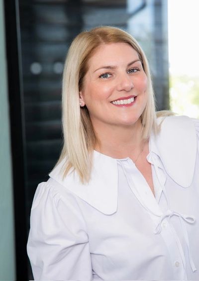 A smiling headshot of Wendy Hadley who leads "Sorted by Wendy"