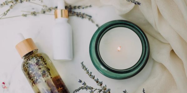 Holistic and Natural Skincare with Candle surrounded by Lavendar