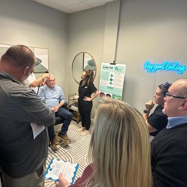Nurse Practitioner models hair restoration treatment at wellness clinic open house 