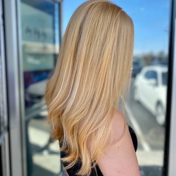 Even, neutral blonde result from a professional color correction service