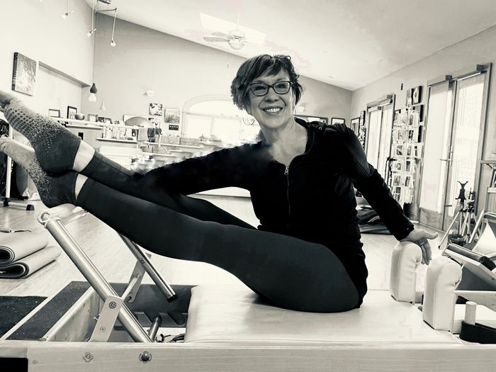 woman on a Pilates Reformer