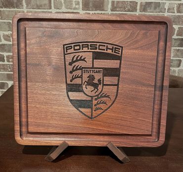 Porsche logo in Closing Time Jr Solid Walnut Board. Just having this in your home brings you one ste