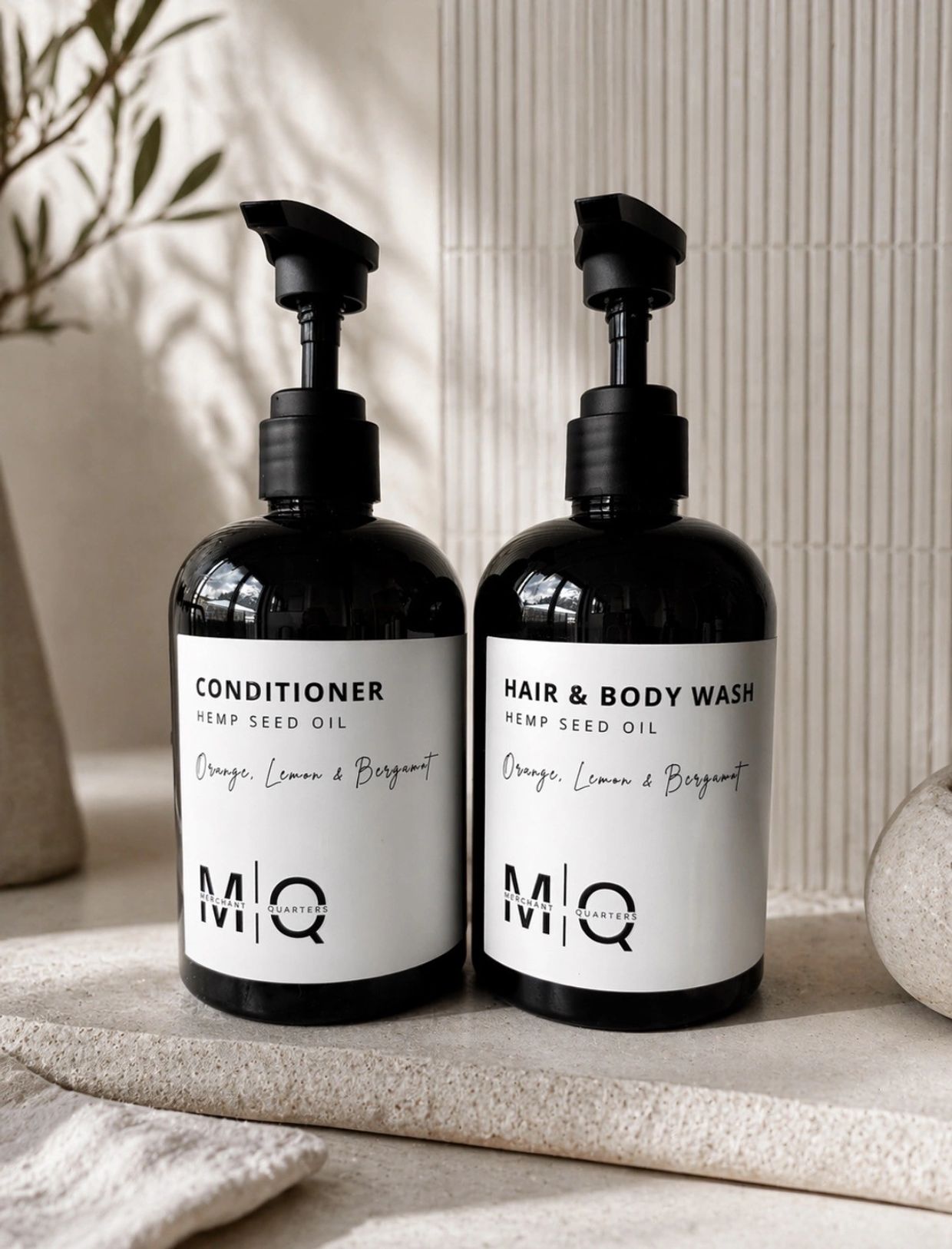 Black bottles of conditioner and hair &amp; body wash with hemp seed oil.