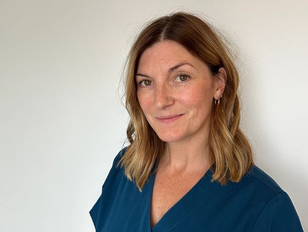 A picture Cherie the reflexologist smiling.